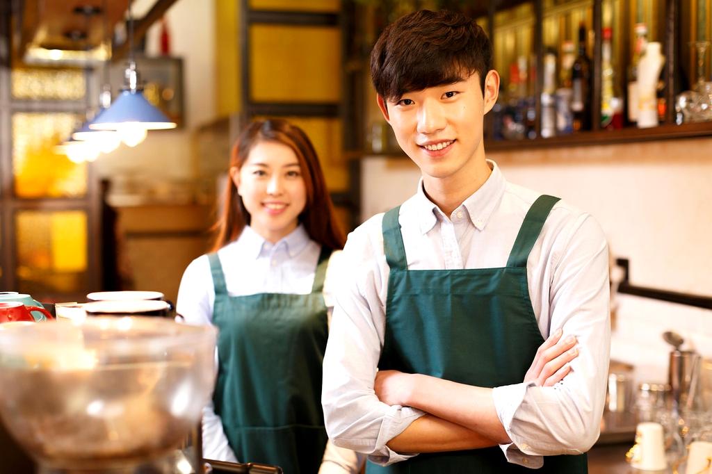 Hospitality worker serving customers in a Kerry restaurant